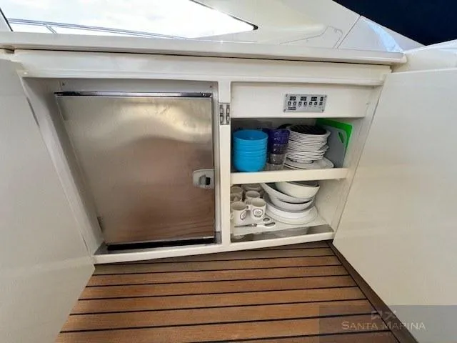  Yacht Photos Pics 2006 Cantieri di Sarnico 60 yacht kitchen with fridge and dish storage.