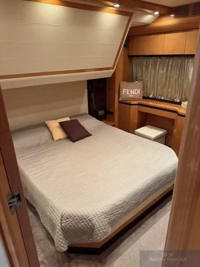  Yacht Photos Pics Luxurious bedroom interior of 2006 Cantieri di Sarnico 60 yacht with elegant decor.