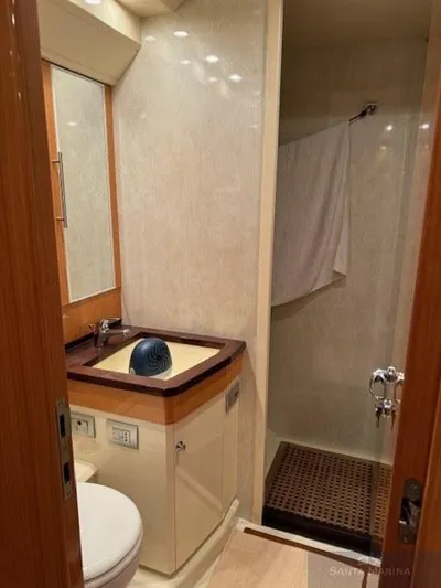  Yacht Photos Pics Luxurious bathroom in 2006 Cantieri di Sarnico 60 yacht, featuring elegant fixtures and shower.