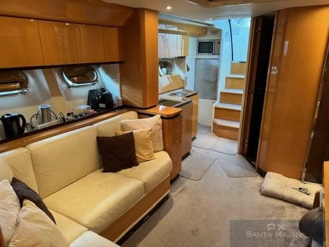  Yacht Photos Pics Luxurious interior of 2006 Cantieri di Sarnico 60 yacht with cozy seating and modern amenities.