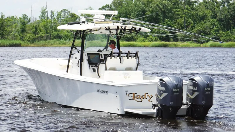  Yacht Photos Pics 2014 Regulator 34 boat with dual Yamaha V8 engines on a calm river.