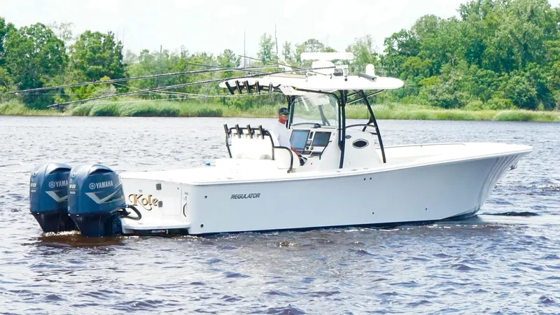  Yacht Photos Pics 2014 Regulator 34 boat with dual Yamaha engines on a calm river.