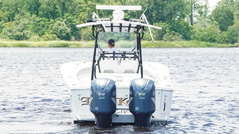  Yacht Photos Pics 2014 Regulator 34 boat with dual Yamaha V8 engines on a lake.