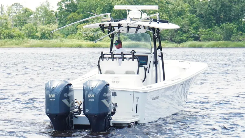  Yacht Photos Pics 2014 Regulator 34 boat with dual Yamaha V8 350 engines on a calm waterway.