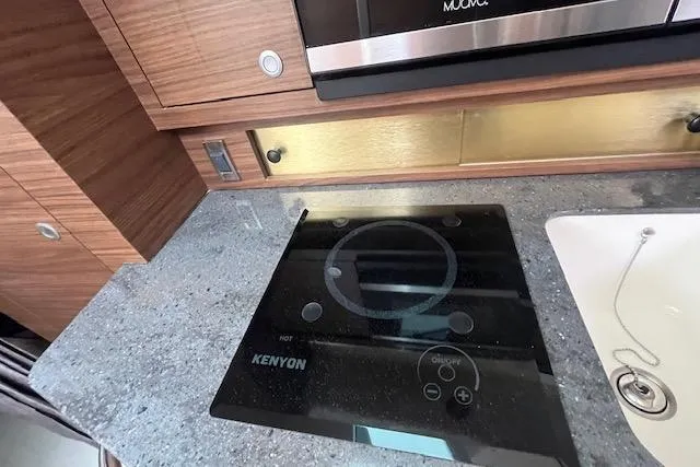  Yacht Photos Pics Modern kitchen area in 2020 Boston Whaler 325 Conquest with Kenyon cooktop.