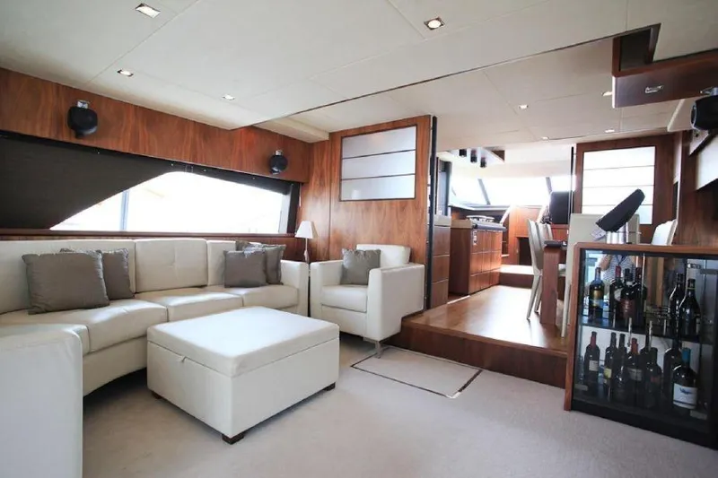 Gala Yacht Photos Pics Luxurious interior of 2012 Fsirline Squadron 78 yacht with elegant seating and wine display.
