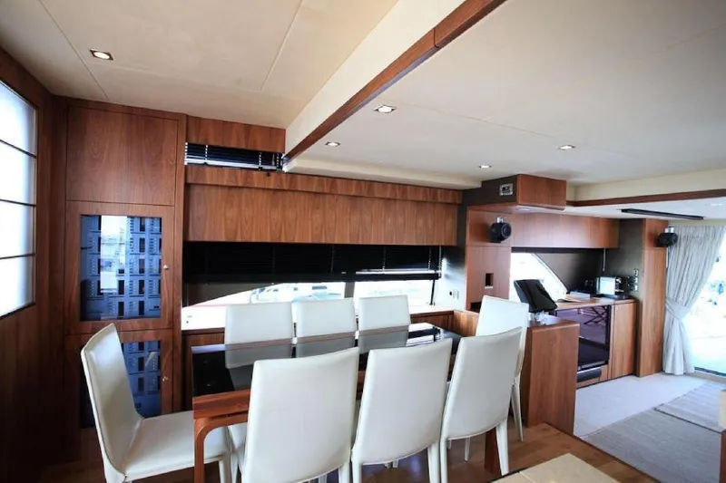 Gala Yacht Photos Pics Luxurious interior of 2012 Fsirline Squadron 78 yacht with elegant dining area.