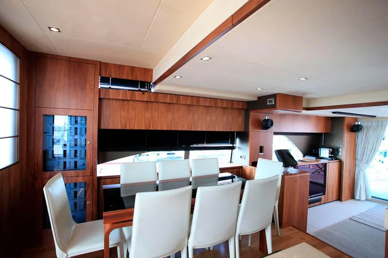 Gala Yacht Photos Pics Luxurious interior of 2012 Fsirline Squadron 78 yacht with elegant dining area.