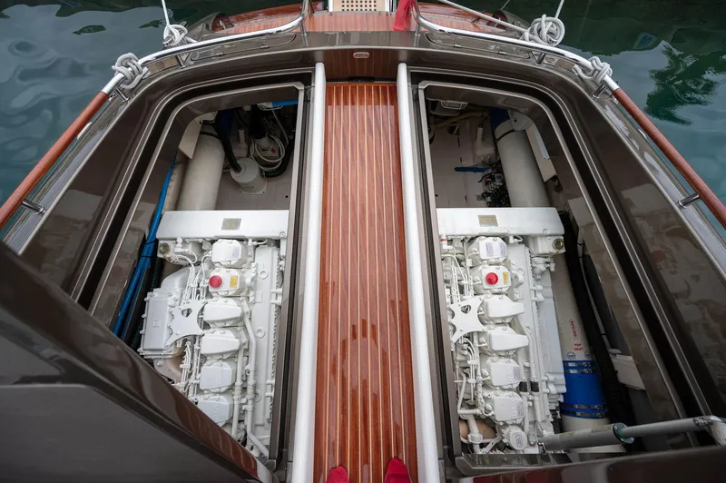  Yacht Photos Pics Engine compartment of 2014 Riva Rivarama Super 44 yacht, showcasing dual engines and wooden deck.