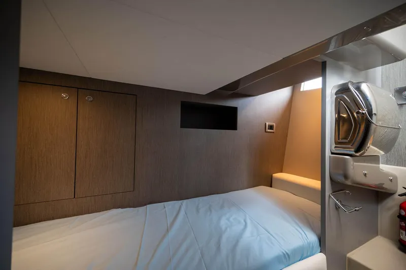  Yacht Photos Pics Interior cabin of 2014 Riva Rivarama Super 44 yacht, featuring a cozy bed and modern design.