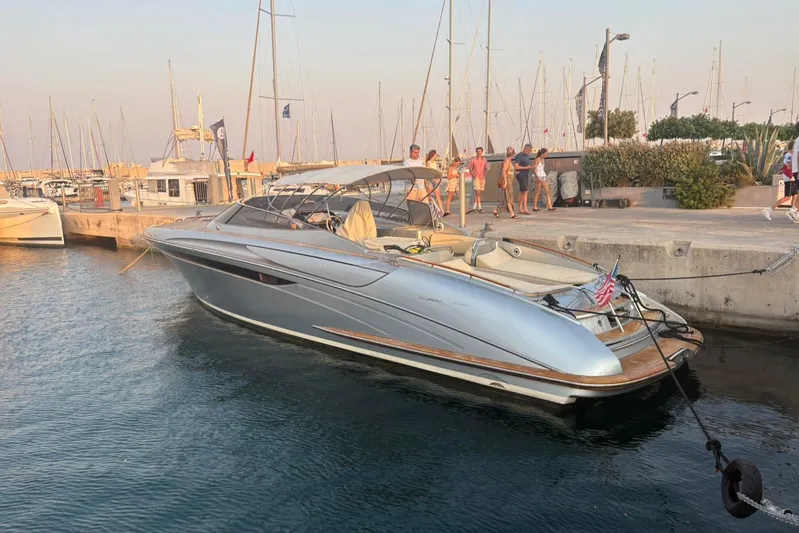  Yacht Photos Pics 2014 Riva Rivarama Super 44 yacht docked at marina with people nearby.