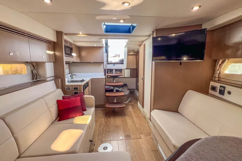  Yacht Photos Pics Luxurious interior of 2018 Sea Ray Sundancer 350 Coupe with modern amenities and elegant design.