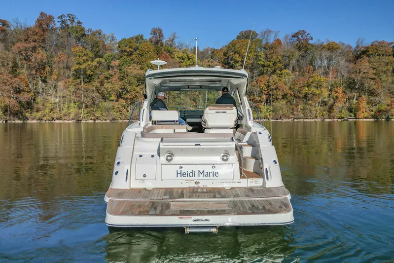  Yacht Photos Pics 2018 Sea Ray Sundancer 350 Coupe on serene lake with autumn foliage backdrop.