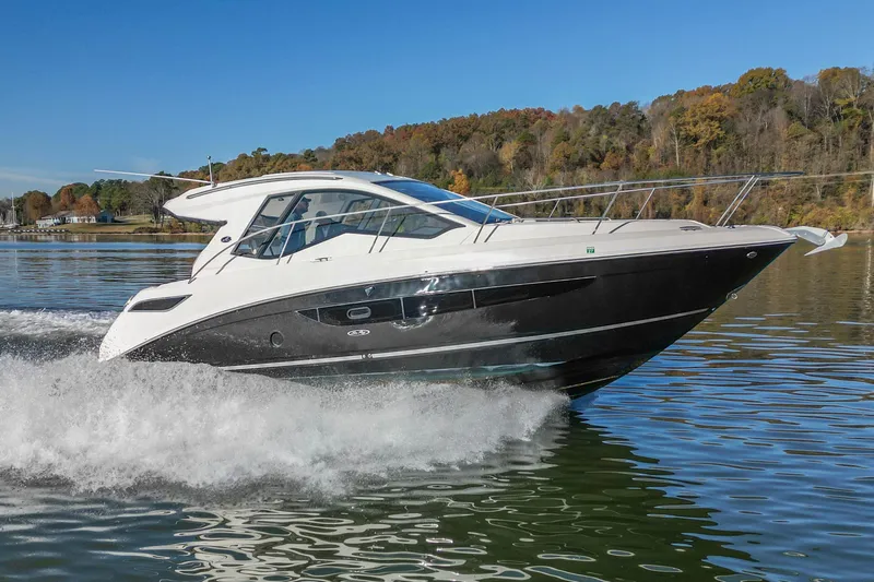  Yacht Photos Pics 2018 Sea Ray Sundancer 350 Coupe cruising on a scenic lake.