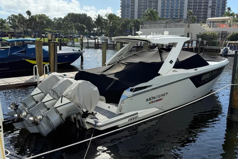  Yacht Photos Pics 2022 Monterey 385 Super Express boat docked with covered engines.
