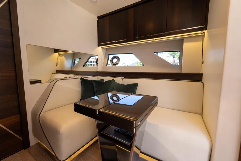 Brew Crew Yacht Photos Pics Luxurious interior of 2022 Sunseeker Predator 60 yacht with elegant seating and modern design.