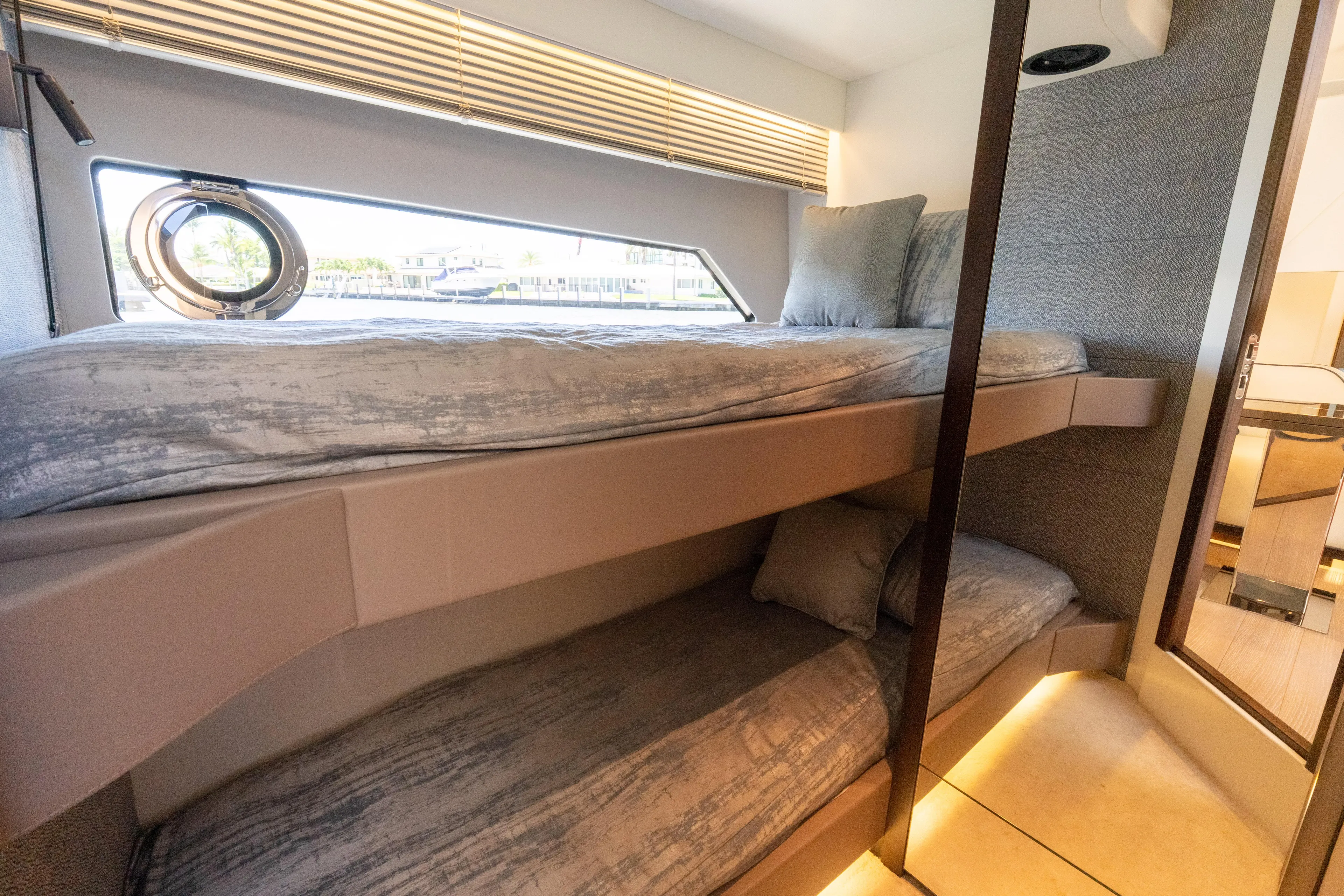 Brew Crew Yacht Photos Pics Interior of 2022 Sunseeker Predator 60 yacht with cozy bunk beds and modern design.