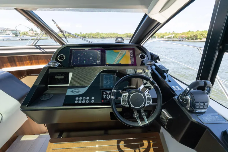 Brew Crew Yacht Photos Pics Cockpit of 2022 Sunseeker Predator 60 yacht with advanced navigation systems.