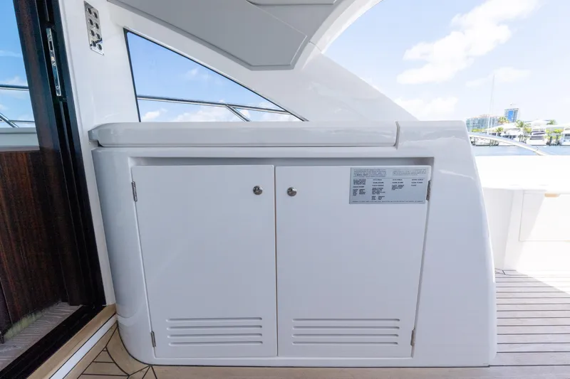 Brew Crew Yacht Photos Pics Sunseeker Predator 60 yacht interior detail, 2022 model, featuring sleek cabinetry and modern design.