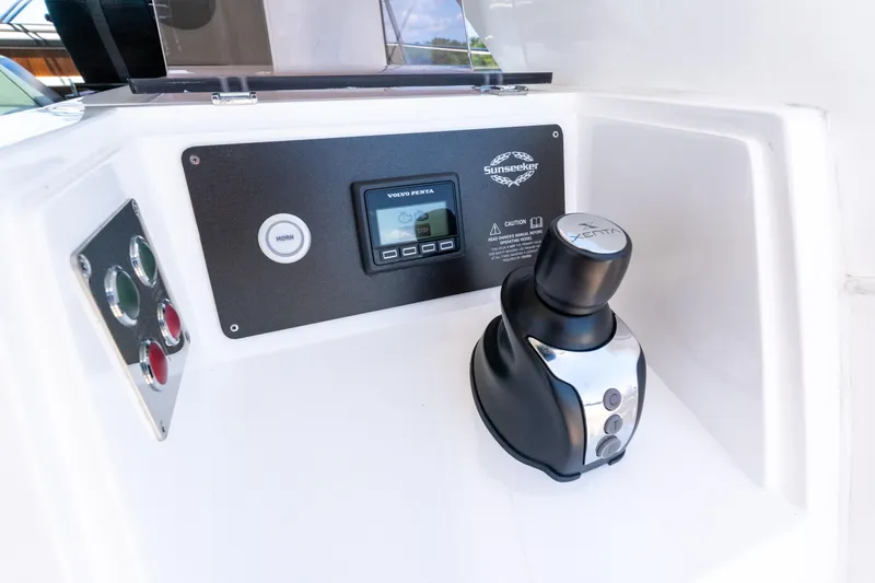 Brew Crew Yacht Photos Pics Control panel of 2022 Sunseeker Predator 60 yacht with joystick and display.