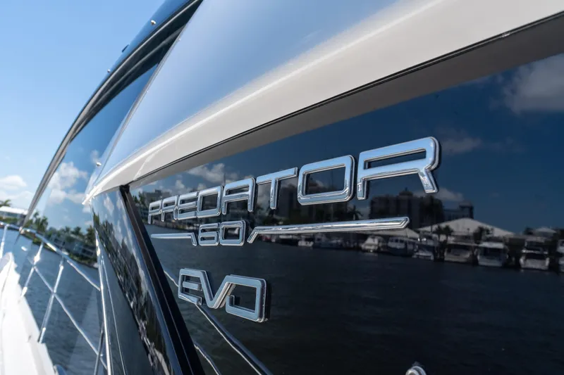 Brew Crew Yacht Photos Pics 2022 Sunseeker Predator 60 yacht with sleek design and reflective surface.