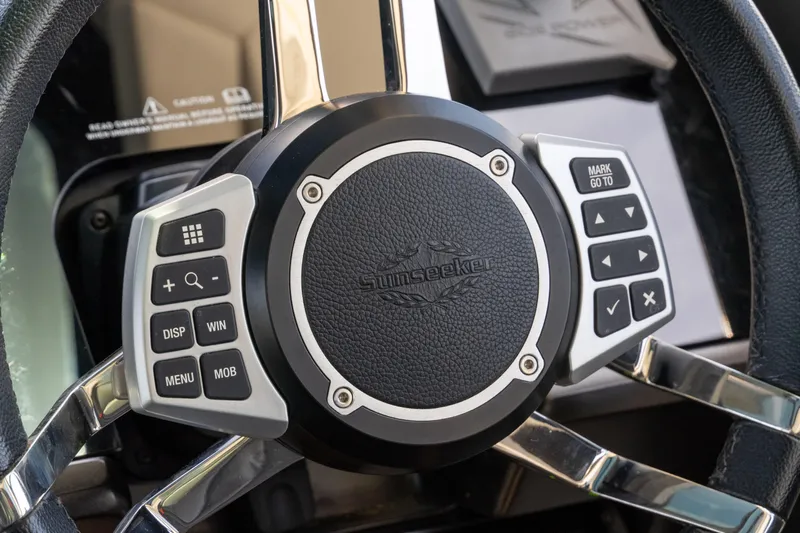 Brew Crew Yacht Photos Pics Steering wheel of 2022 Sunseeker Predator 60 yacht with control buttons.
