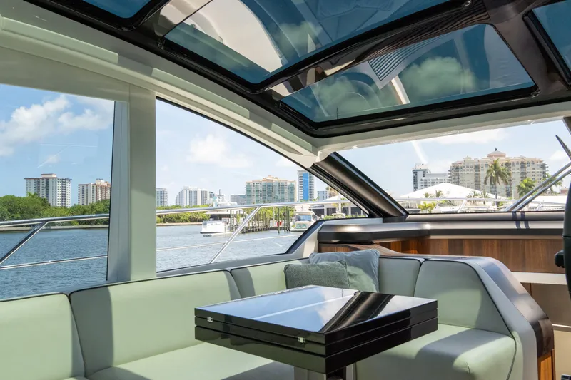 Brew Crew Yacht Photos Pics Luxurious interior of 2022 Sunseeker Predator 60 yacht with cityscape view.