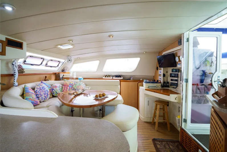 Dreaming On Yacht Photos Pics Luxurious interior of a 2003 Leopard 47 catamaran with cozy seating and modern amenities.
