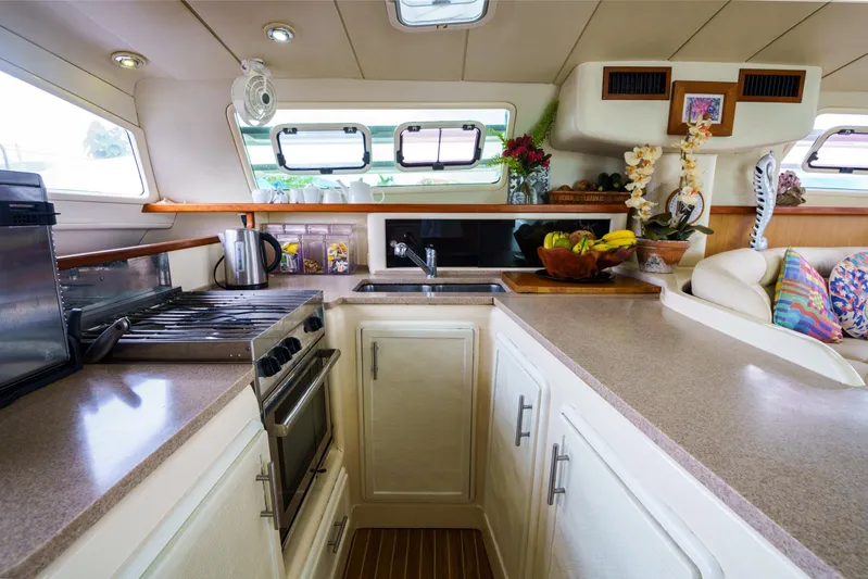 Dreaming On Yacht Photos Pics Spacious kitchen in a 2003 Leopard 47 yacht with modern appliances and elegant decor.
