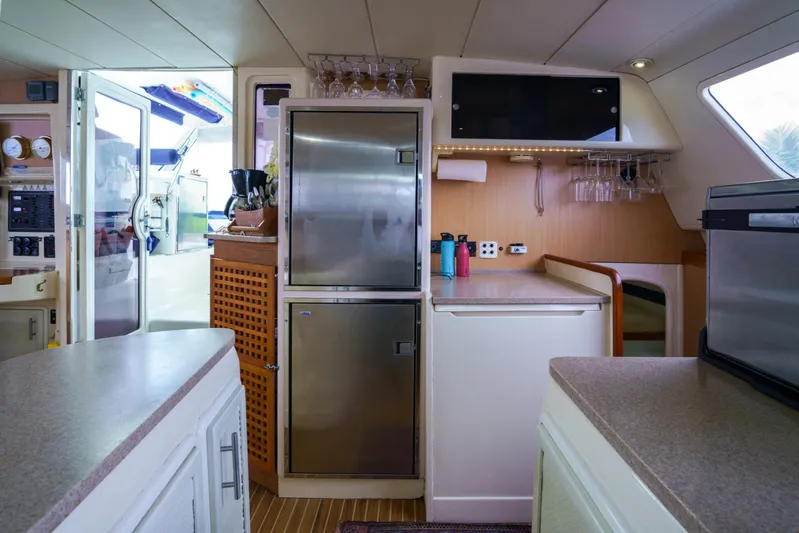 Dreaming On Yacht Photos Pics Interior of 2003 Leopard 47 yacht kitchen with modern appliances and ample storage.