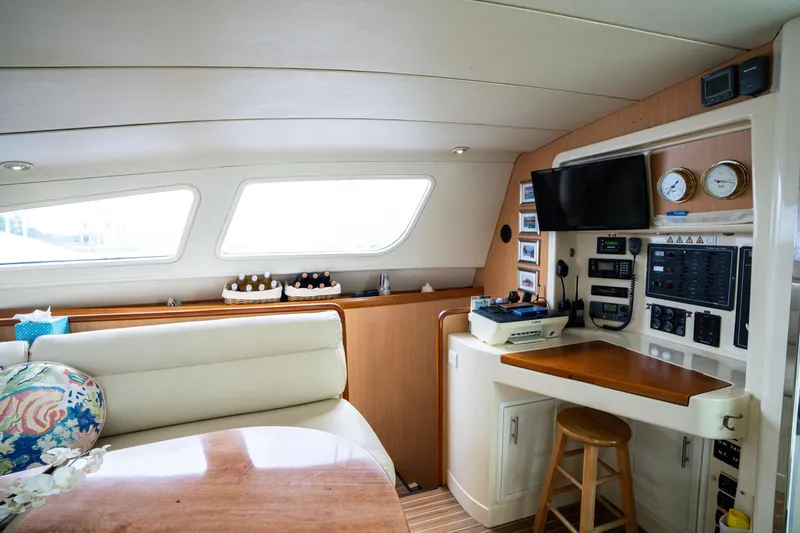 Dreaming On Yacht Photos Pics Interior of 2003 Leopard 47 yacht with navigation station and seating area.