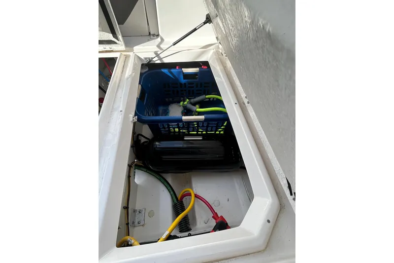  Yacht Photos Pics 2024 Cutwater C-288 Coupe storage compartment with organized cables and equipment.