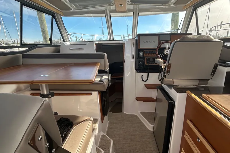  Yacht Photos Pics Interior of 2024 Cutwater C-288 Coupe boat with modern helm and seating area.