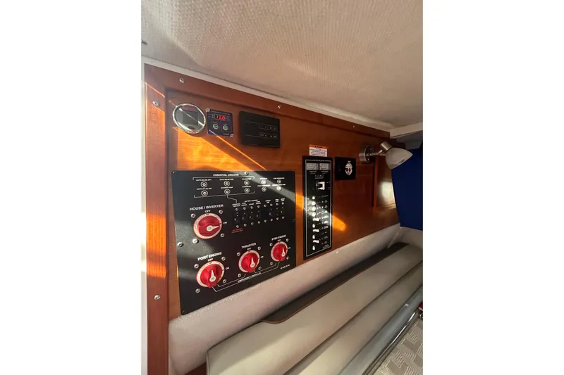  Yacht Photos Pics 2024 Cutwater C-288 Coupe control panel with switches and gauges in cabin interior.