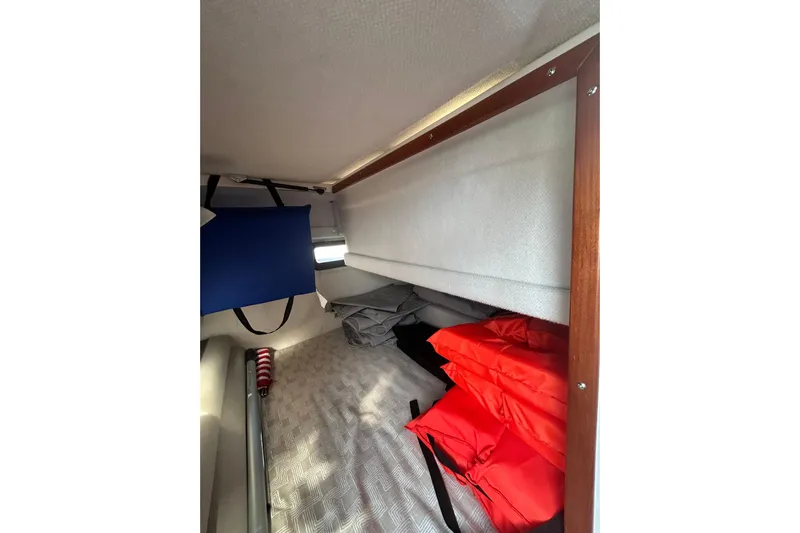  Yacht Photos Pics 2024 Cutwater C-288 Coupe interior storage with life jackets and accessories.
