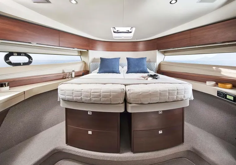 Yacht Photos Pics Luxurious 2025 Princess 50 Flybridge yacht bedroom with modern design and elegant furnishings.