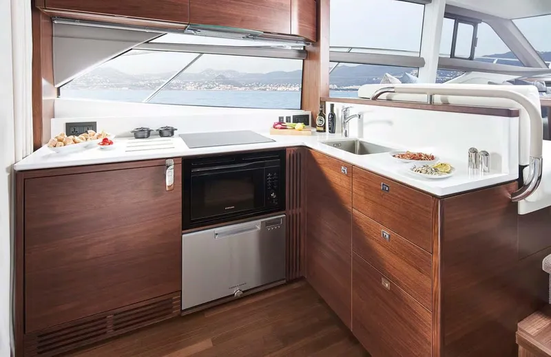  Yacht Photos Pics Modern kitchen interior on 2025 Princess 50 Flybridge yacht with ocean view.