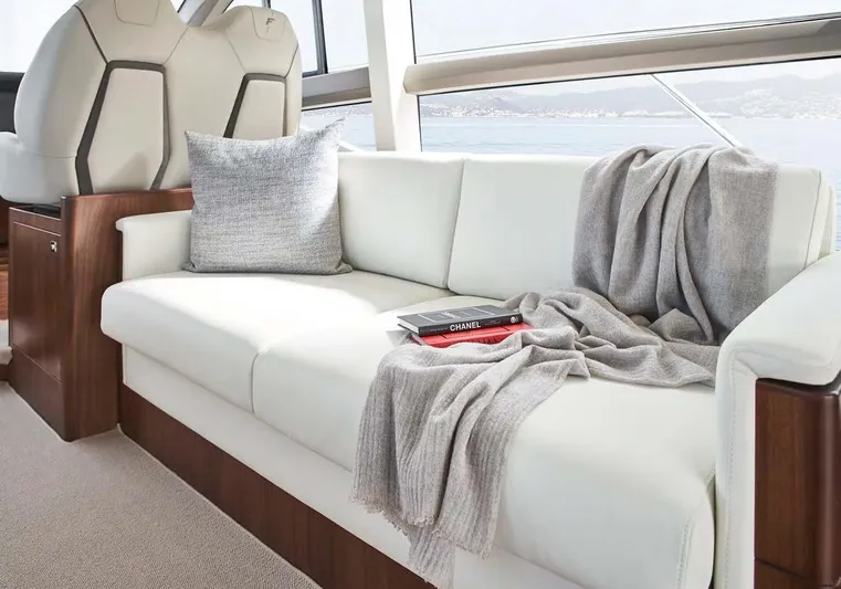  Yacht Photos Pics Luxurious interior of 2025 Princess 50 Flybridge yacht with elegant white sofa and decor.