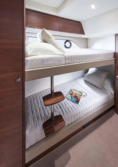  Yacht Photos Pics 2025 Princess 50 Flybridge yacht cabin with bunk beds and modern design.