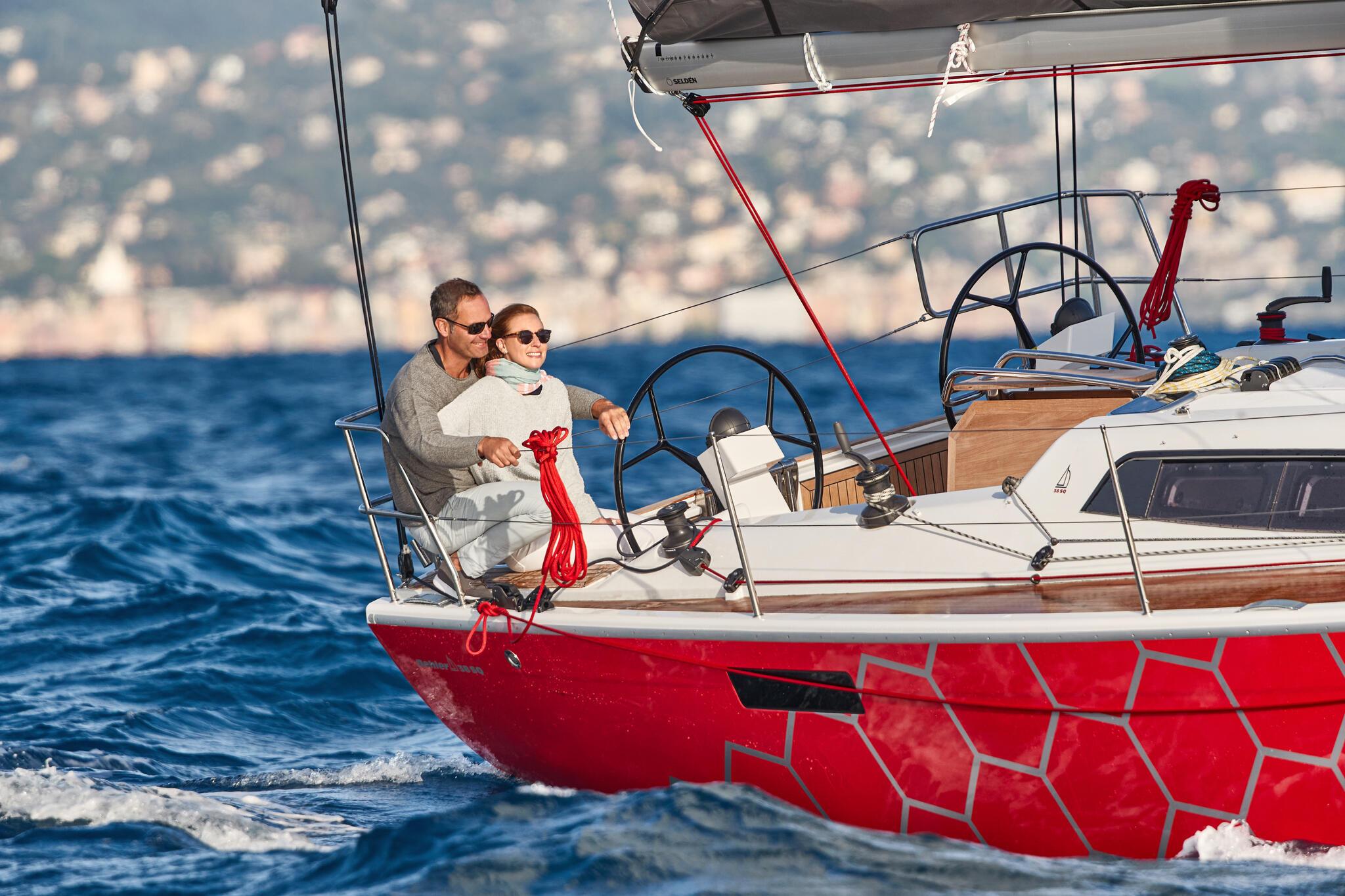 2025 Dehler 38 SQ sailing on open water with two people on deck
