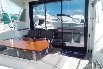  Yacht Photos Pics 2016 Prestige 450S yacht with outdoor seating and glass doors.