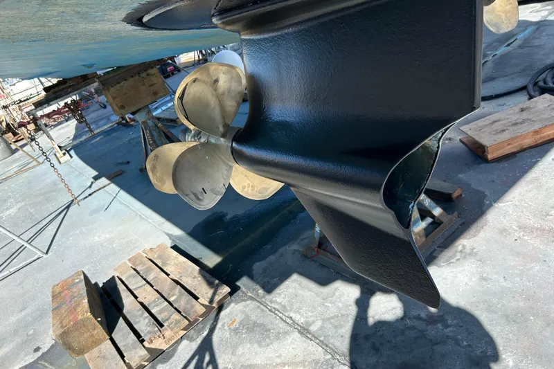  Yacht Photos Pics Close-up of a 2016 Prestige 450S boat propeller and rudder in dry dock.