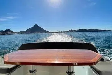  Yacht Photos Pics Prestige 450S yacht cruising on open water with scenic mountain view, 2016 model.