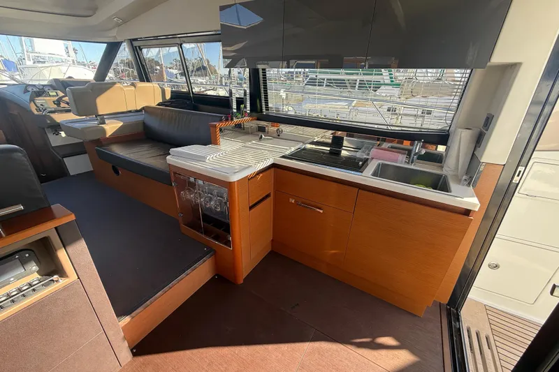  Yacht Photos Pics Luxurious interior of 2016 Prestige 450S yacht with modern kitchen and seating area.