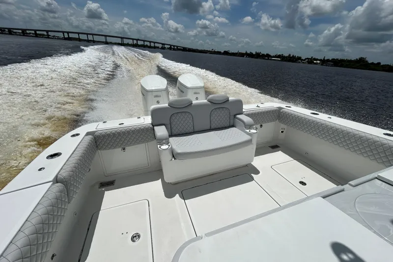  Yacht Photos Pics 2023 HCB 39 Speciale boat cruising on water, showcasing luxurious seating and powerful engines.