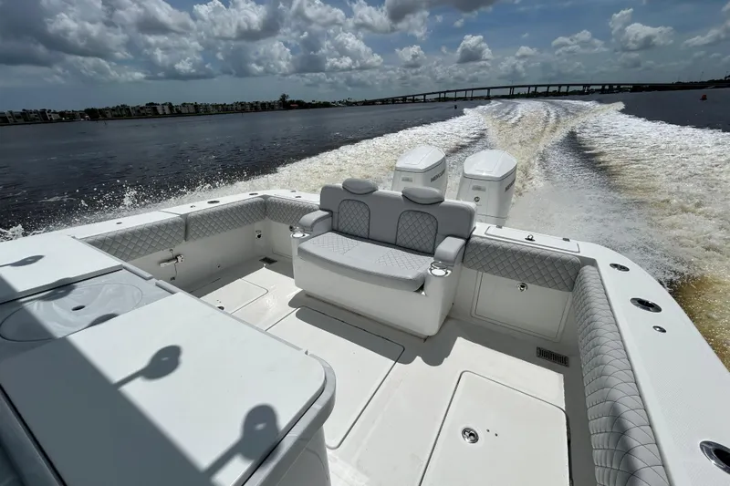  Yacht Photos Pics 2023 HCB 39 Speciale boat cruising on water, showcasing luxurious seating and powerful engines.