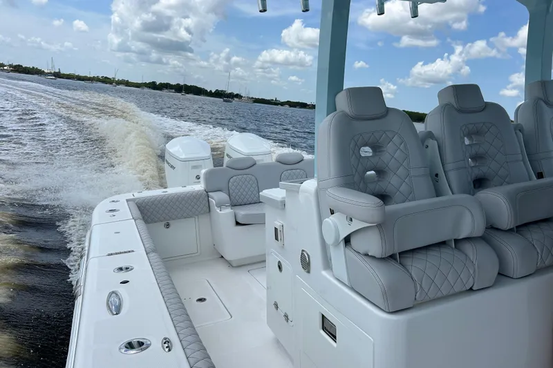  Yacht Photos Pics Luxury interior of 2023 HCB 39 Speciale boat with plush seating on open water.