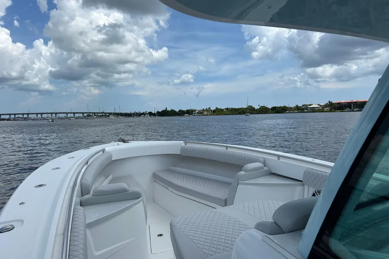  Yacht Photos Pics 2023 HCB 39 Speciale boat on calm water under a cloudy sky.
