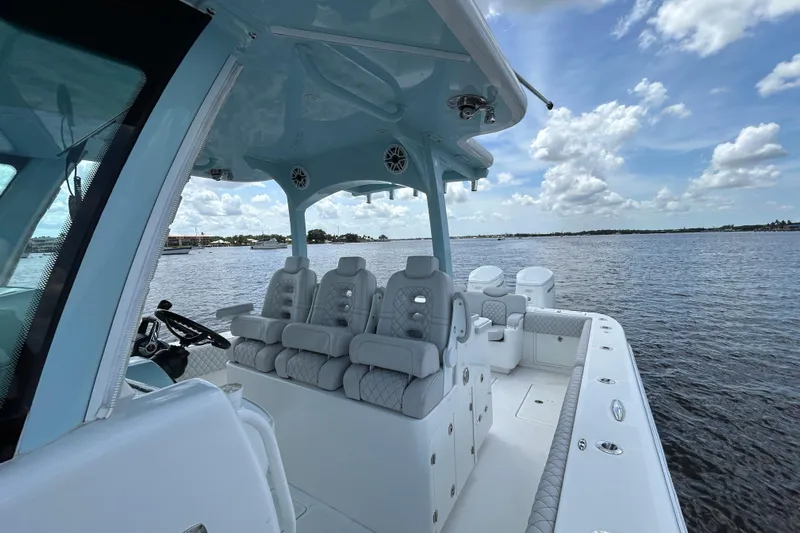  Yacht Photos Pics 2023 HCB 39 Speciale boat interior with luxurious seating on a calm water backdrop.