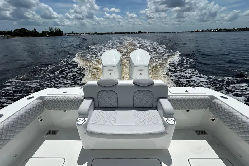  Yacht Photos Pics 2023 HCB 39 Speciale boat with luxurious seating, cruising on a sunny day.